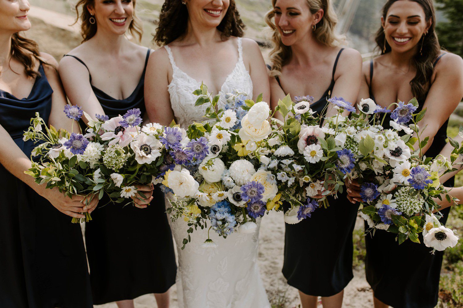 Bridesmaids with summer wedding bouquets