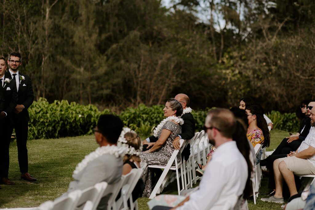 Wedding guests at wedding ceremony in Hawaii 