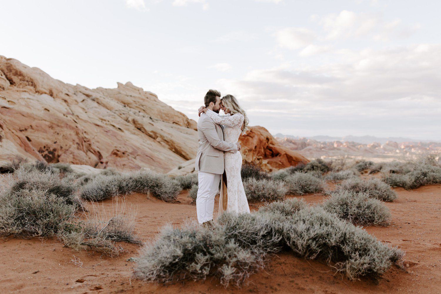 Valley of Fire engagement photos with couple forehead to forehead. 