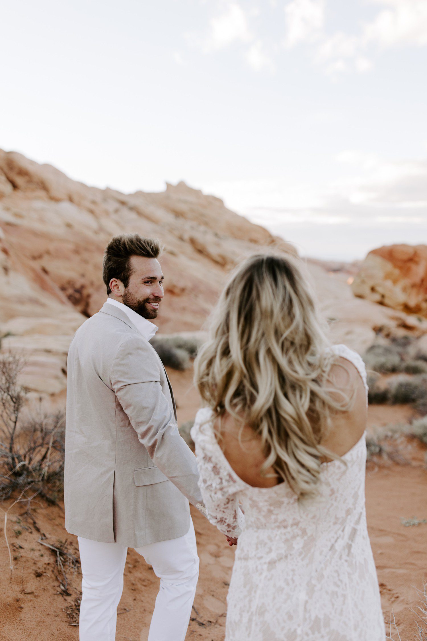 Couple walking on rocks at Valley of Fire. 