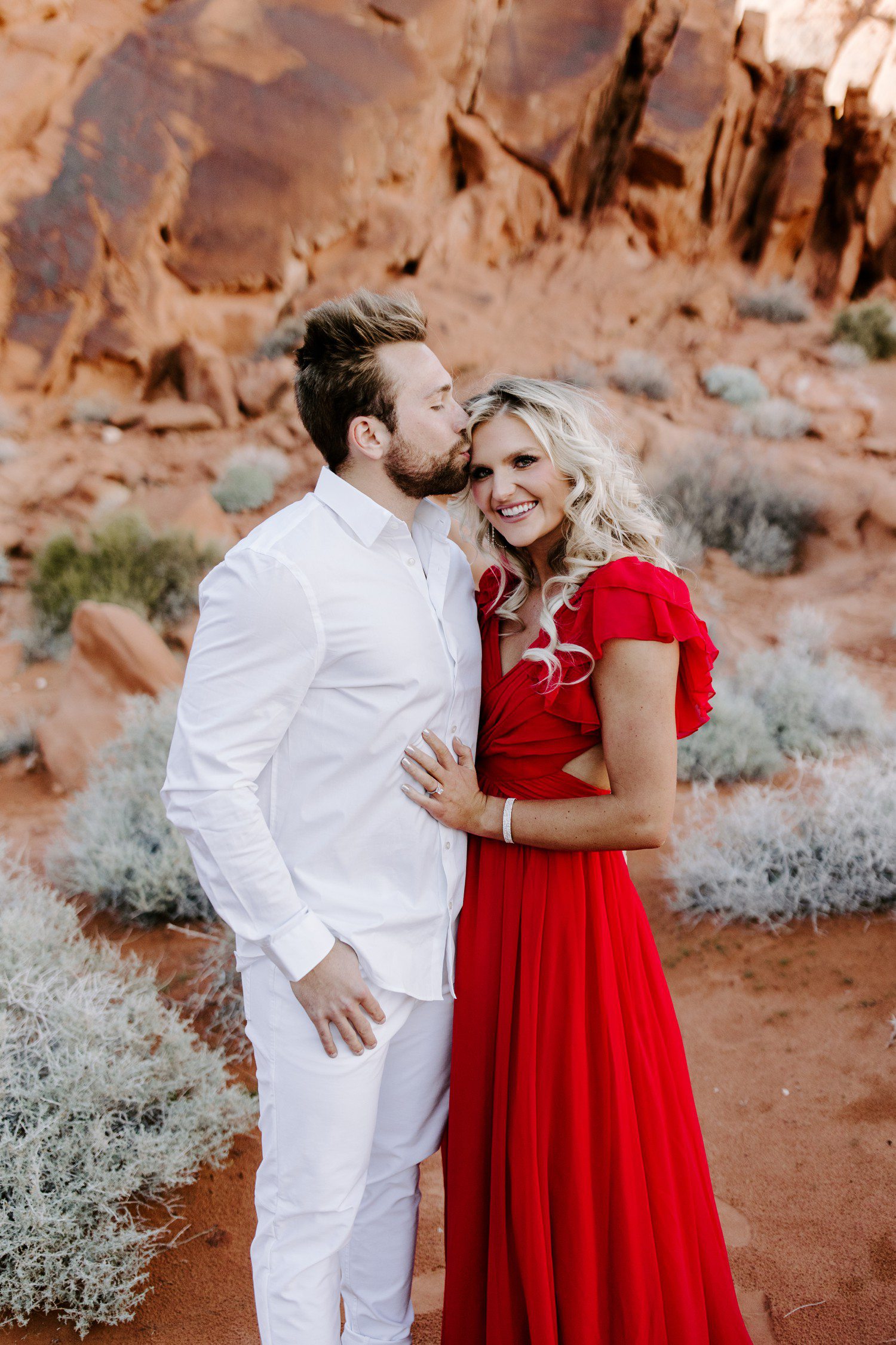 Guy kissing forehead for engagement session at Valley of Fire 