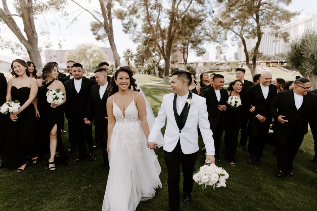 Wedding party photos at Las Vegas Country club with bridesmaids and groomsmen in all black. 