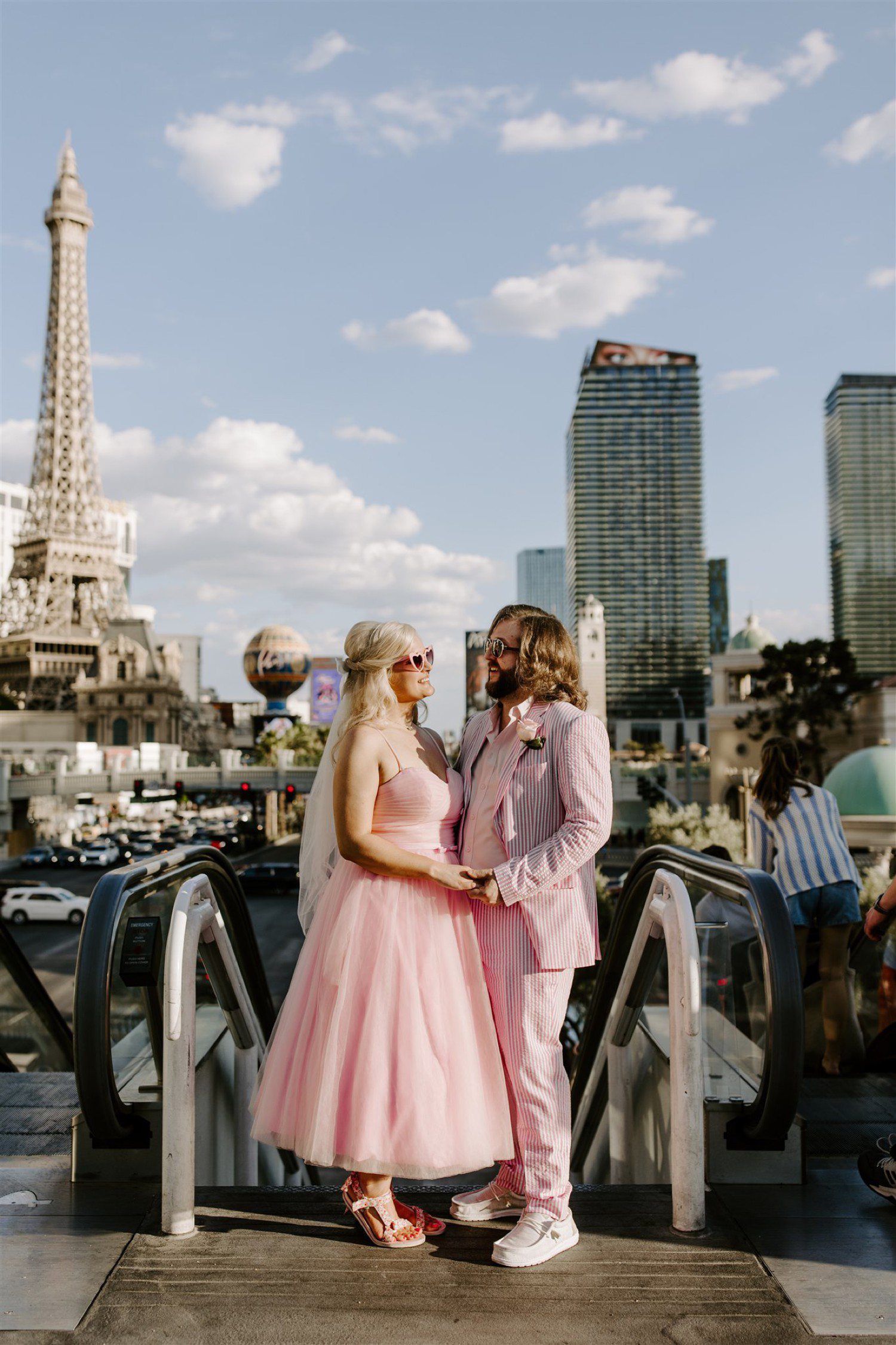 Las Vegas Wedding photos on the strip with couple in pink wedding attire.