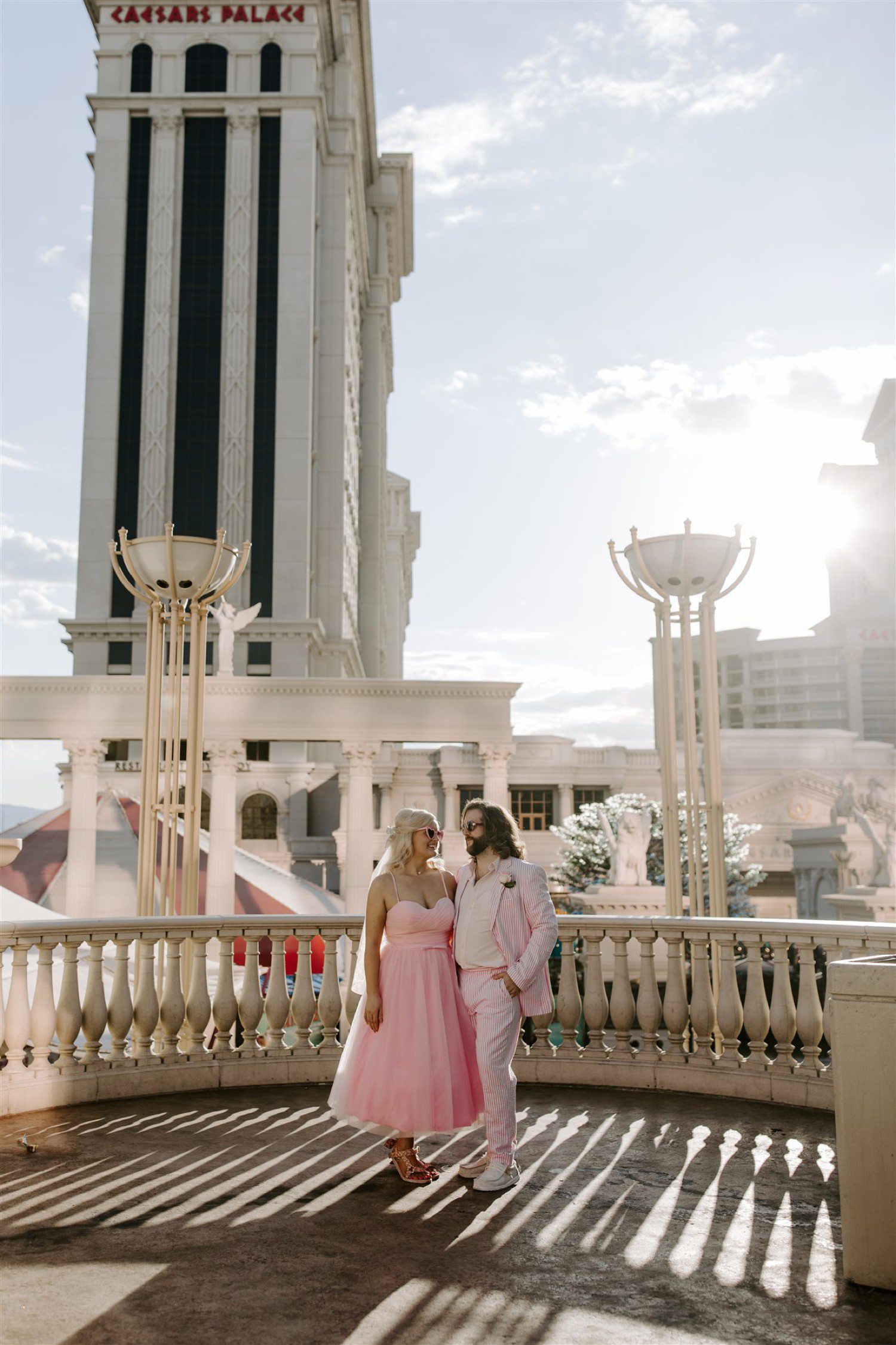 Bride and groom wearing pink for wedding in Las Vegas.