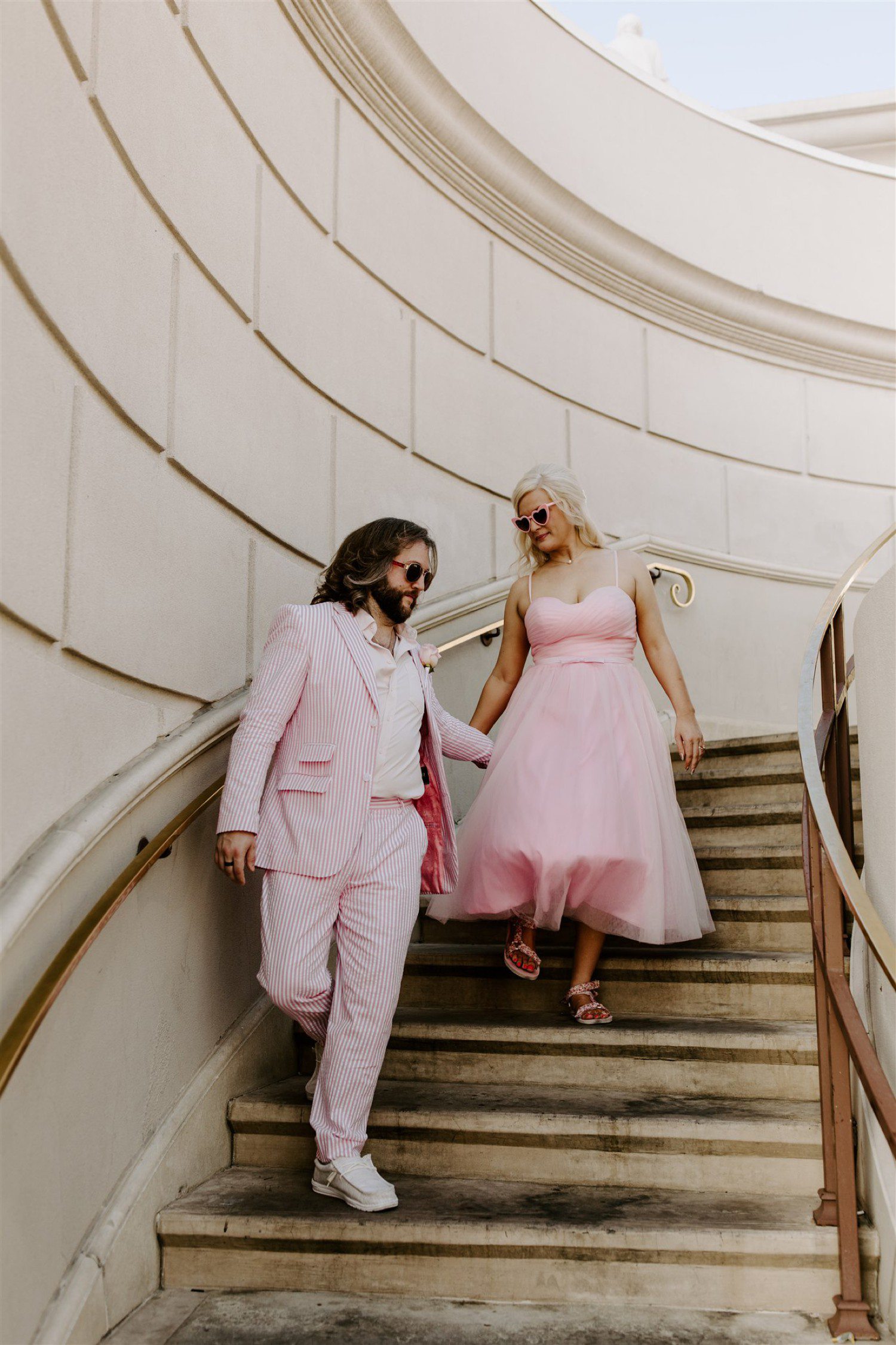 Couple walking down the stairs for Las Vegas wedding photos.