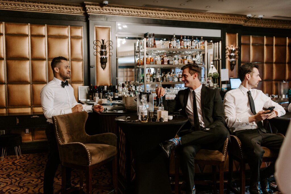 Groom and groomsmen hanging out at The Stirling Club.