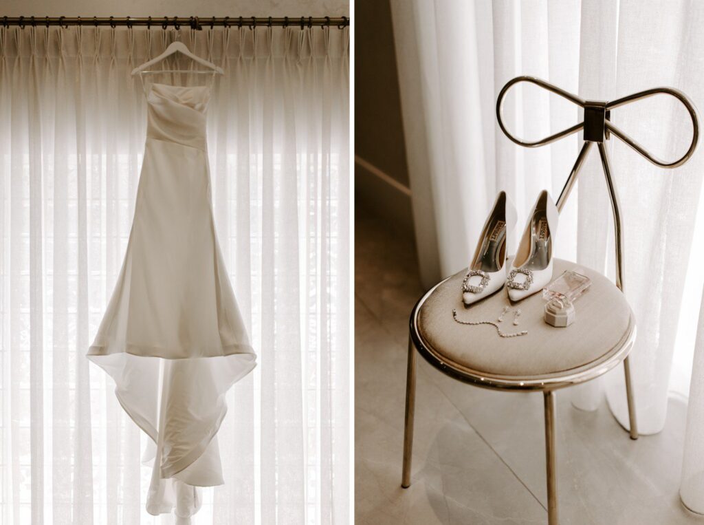 Bride's dress hanging and wedding details on a chair.
