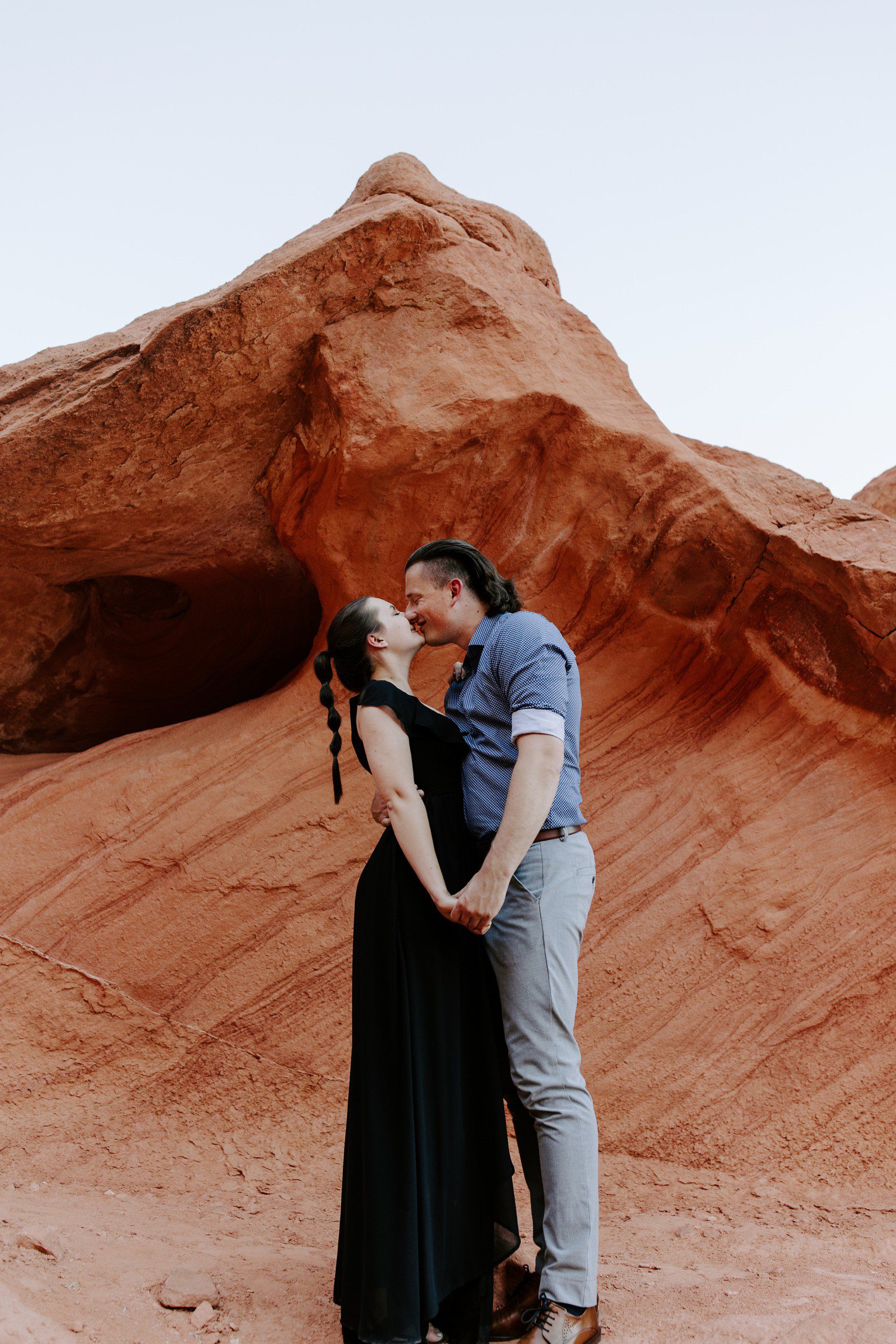 Couple standing for engagement photos at valley of fire. 