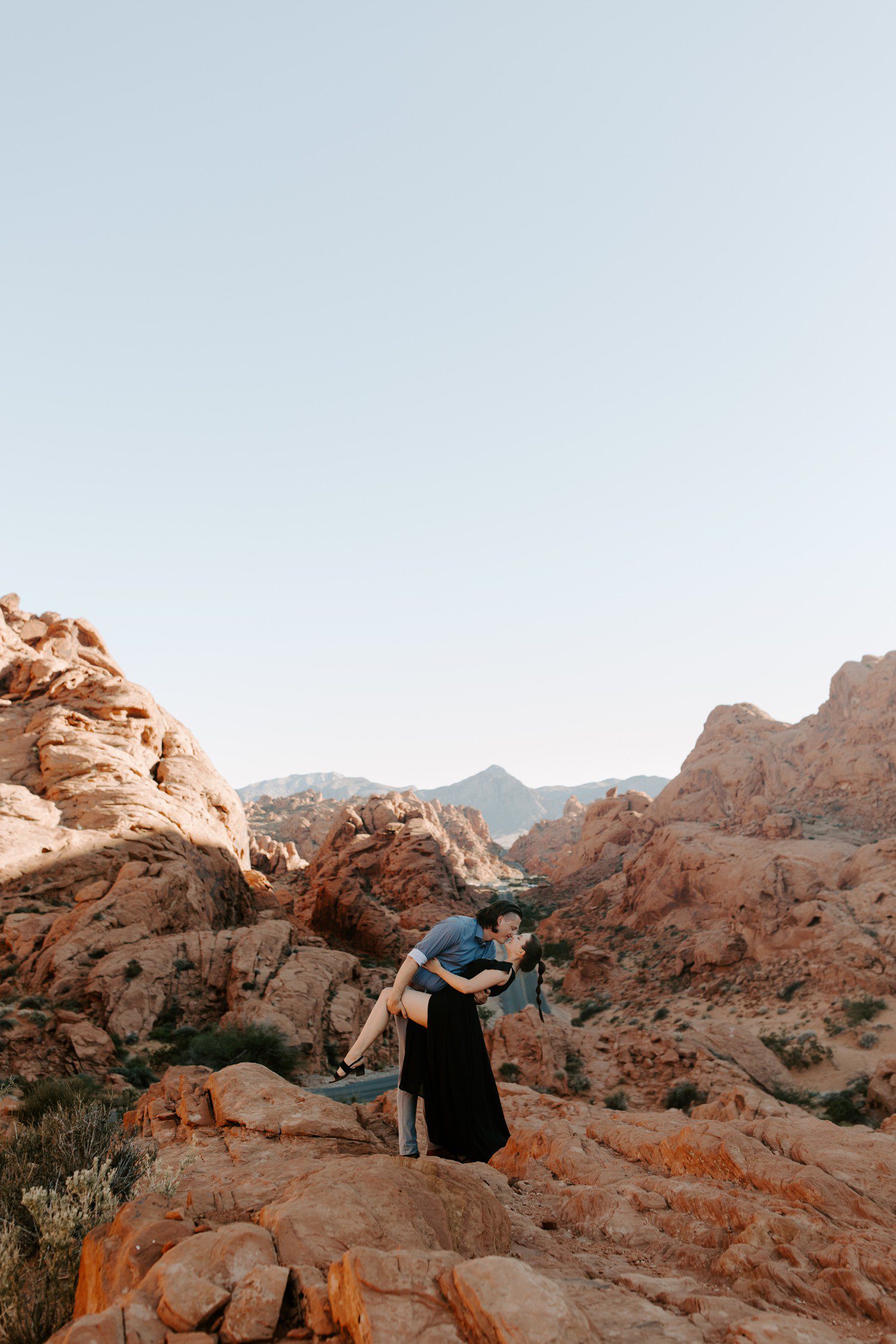 Couple kissing for engagement session at Valley of Fire. 
