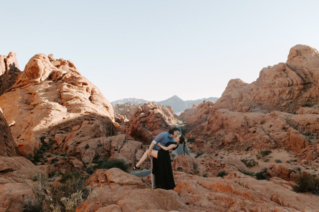 Couple kissing for engagement photos at valley of fire.