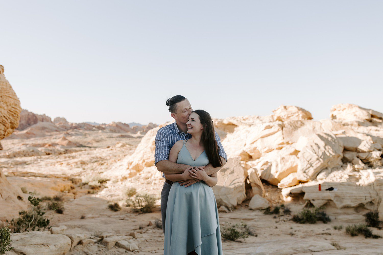 Couple hugging for engagement photos. 