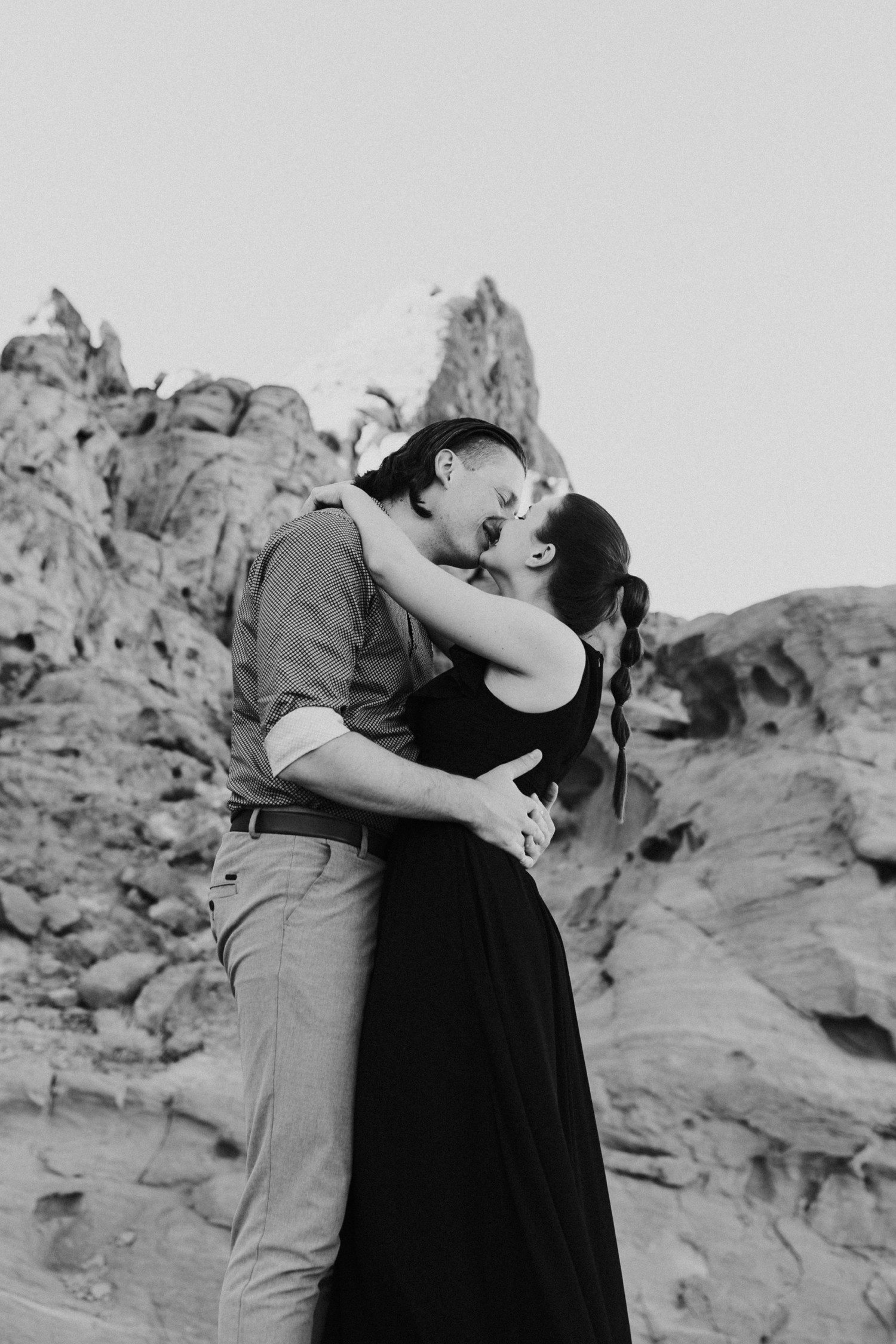 Kissing engagement photos in the desert in Las Vegas. 