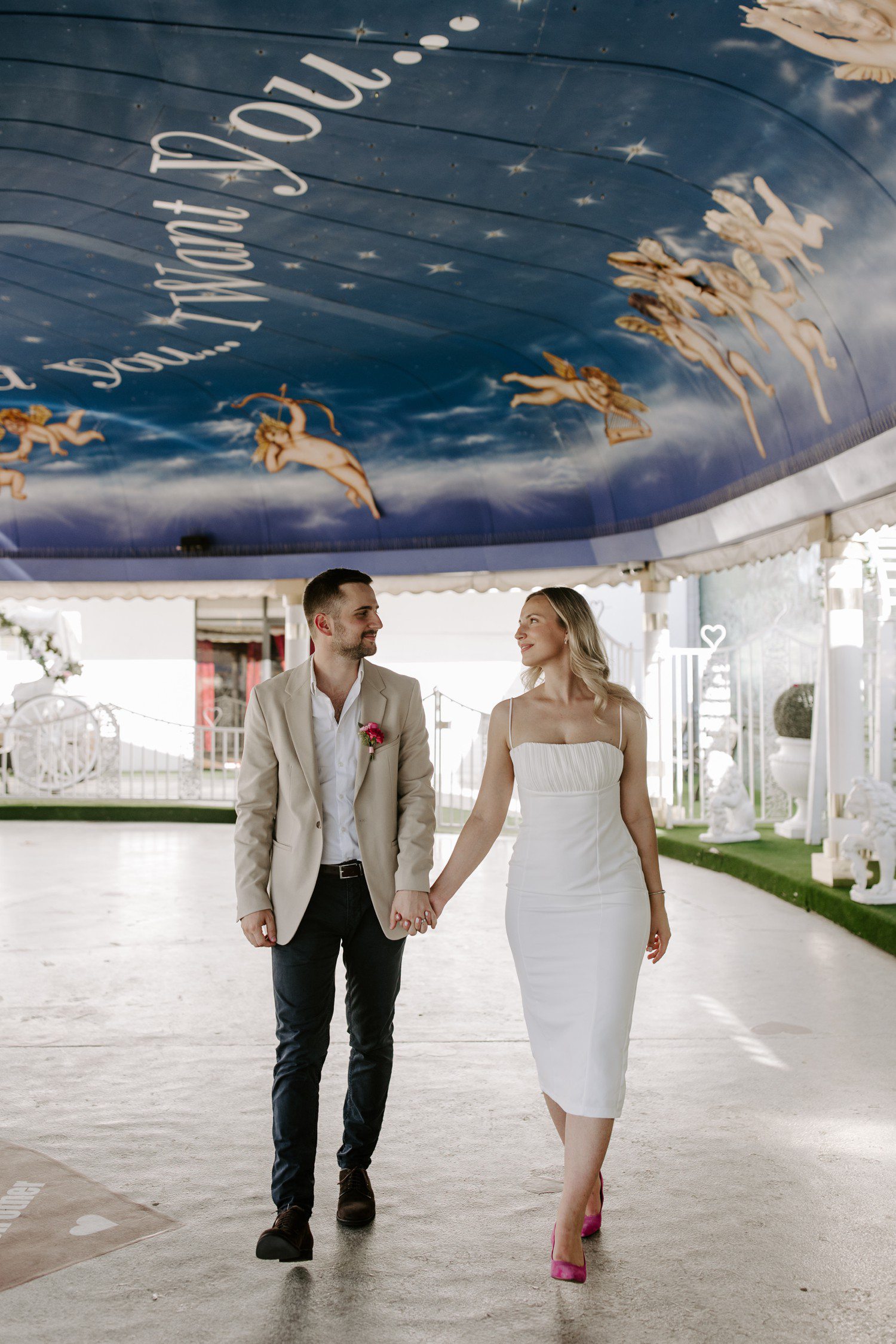 Couple walking in the Tunnel of Love at A Little White Chapel Las Vegas.