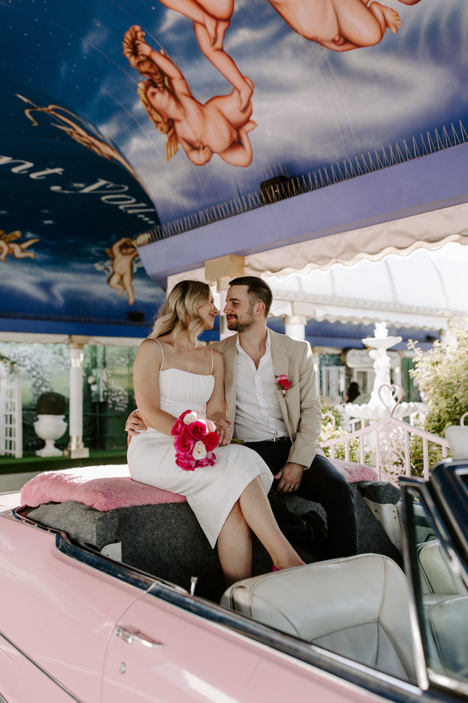 Photos in the pink Cadillac at A Little White Chapel.
