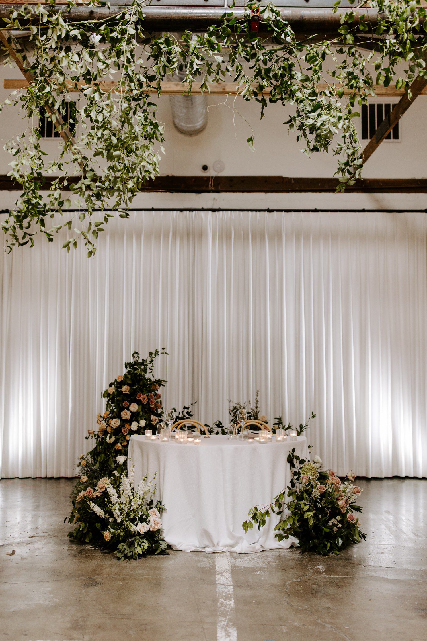 Bride and groom wedding reception table decor.