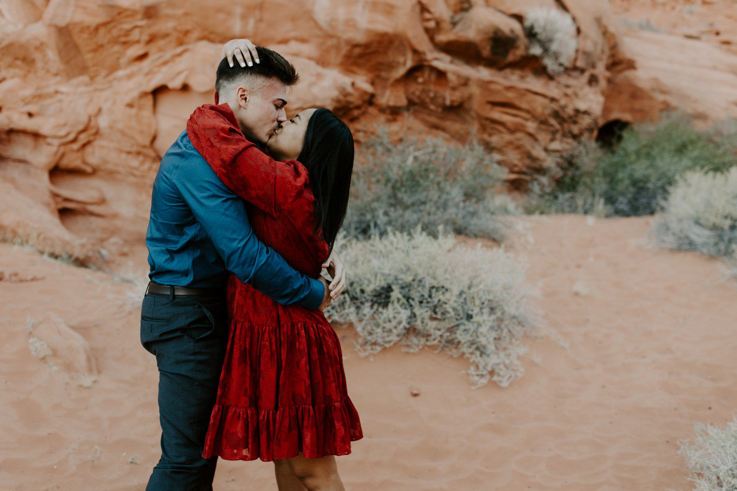 Couple kissing after surprise proposal in Las Vegas.