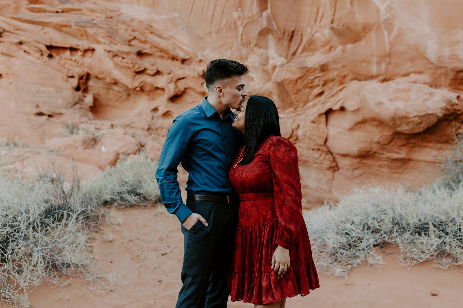 Forehead kiss during engagement photos at Valley of Fire.