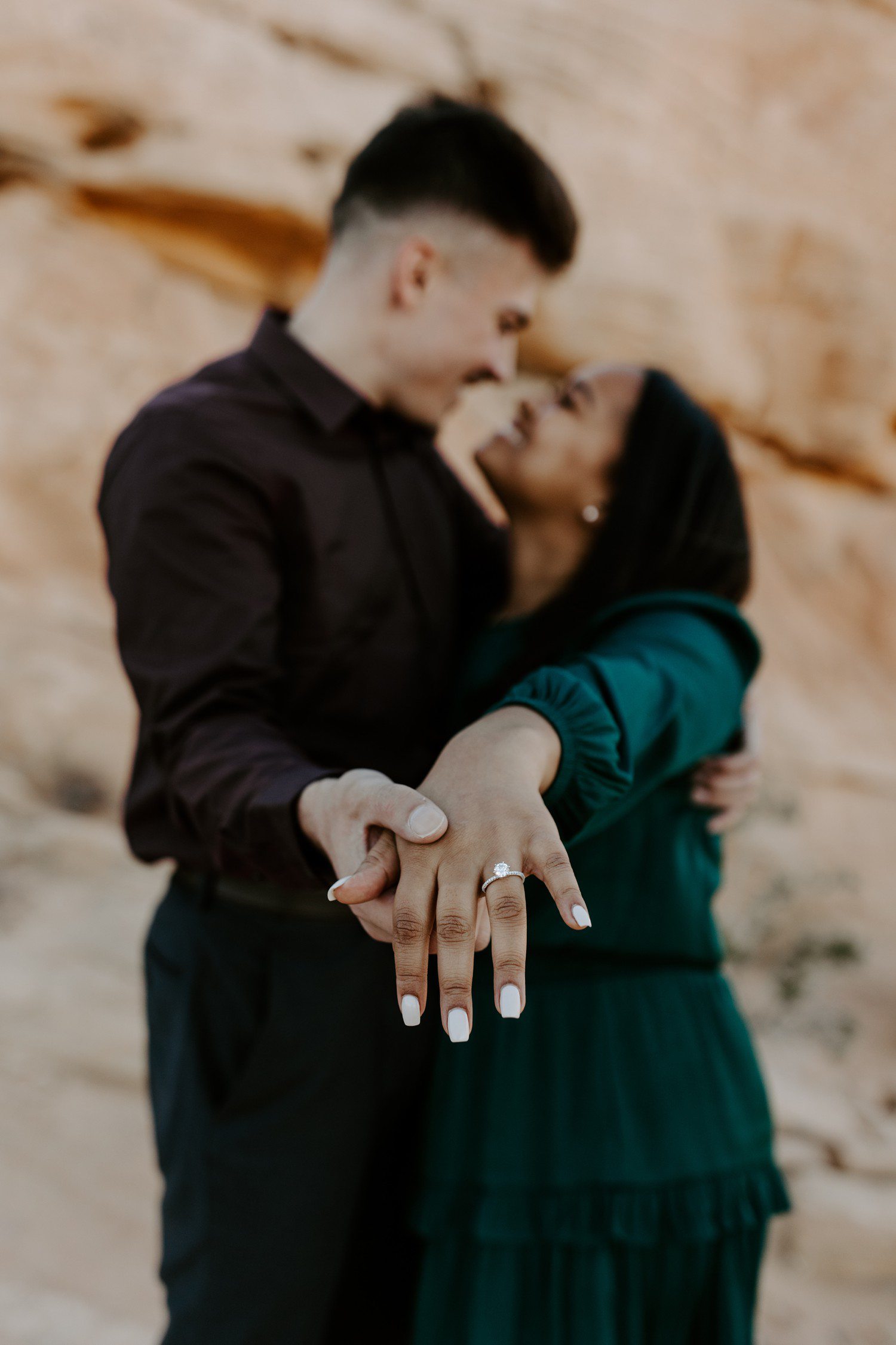 Showing off engagement ring after surprise proposal in Las Vegas.