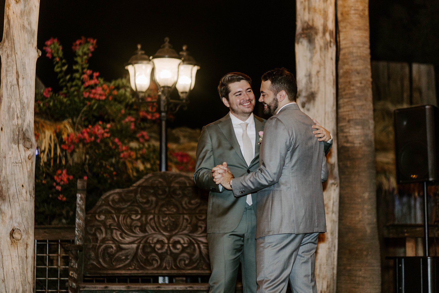 Grooms smiling during wedding first dance at Boojum Tree.