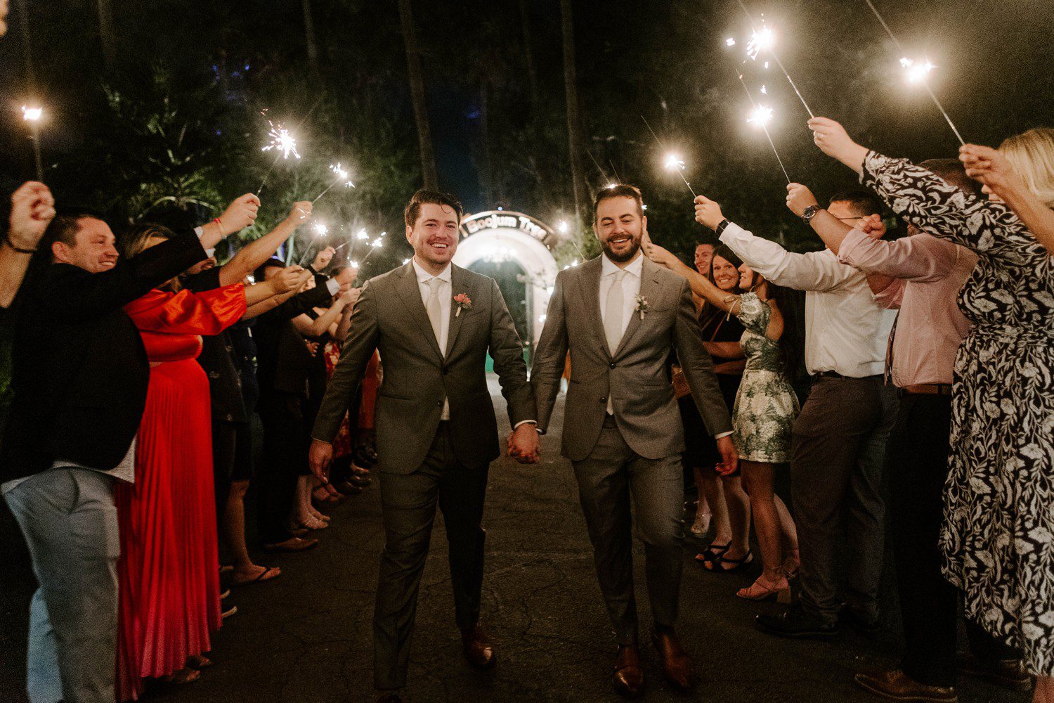 Two grooms doing sparkler exit at Boojum Tree.