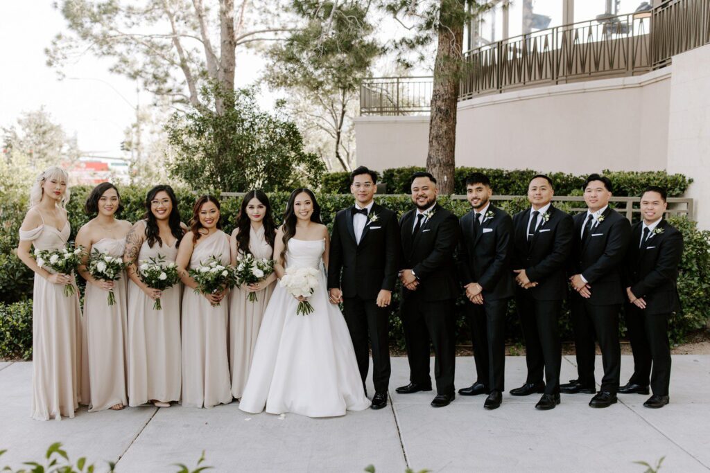 Wedding party photos with champagne bridesmaid dresses and groomsmen in black suits.