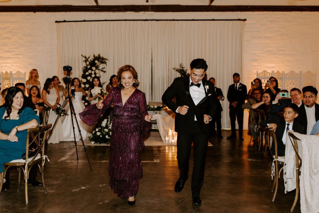 Groom and mother dancing at wedding reception.