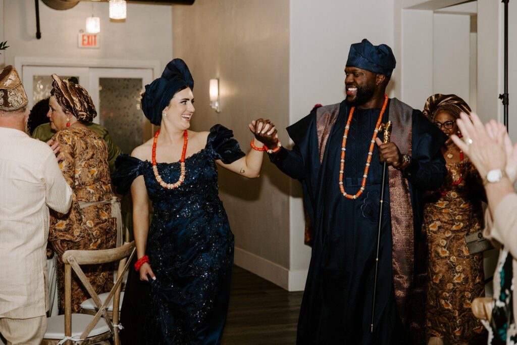 Nigerian wedding reception outfits for bride and groom. 