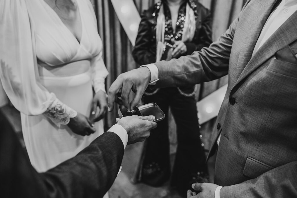 man takes ring out of small tin for Spring Mountains elopement