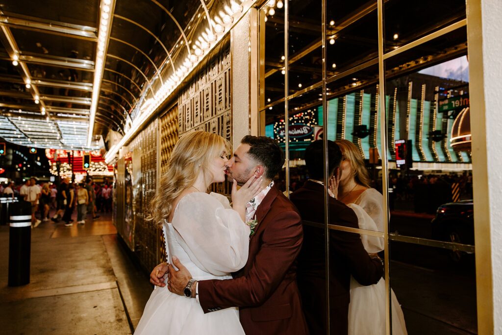 couple kisses on Fremont street after Elvis ceremony