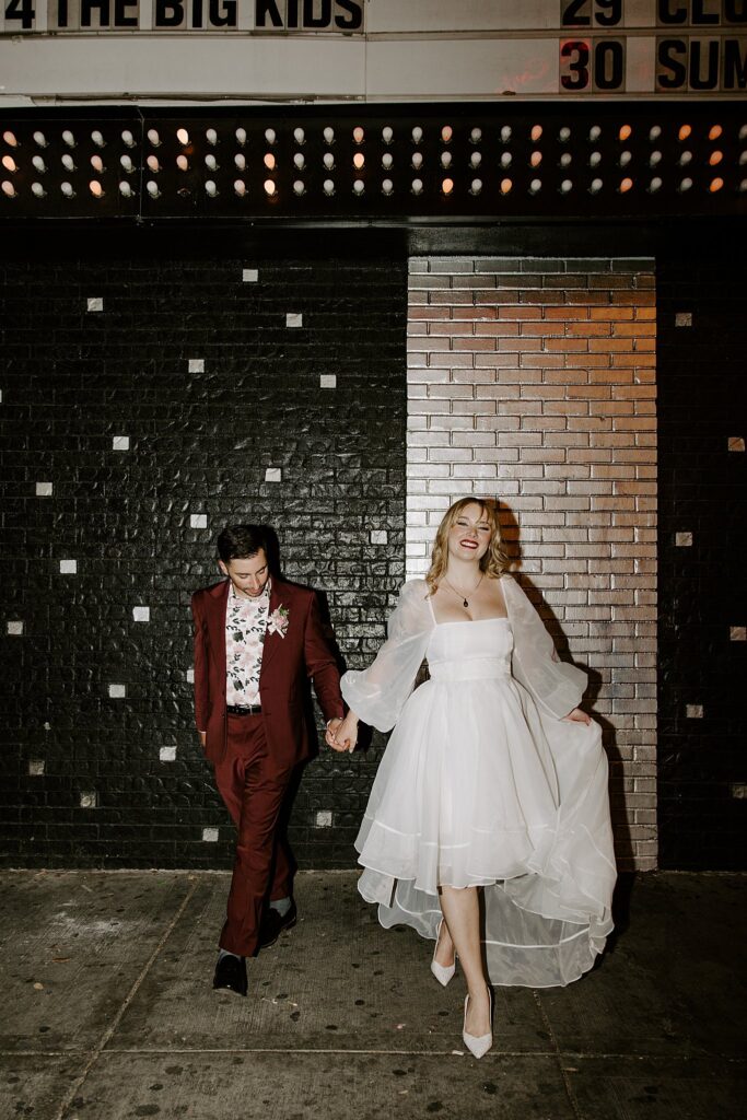 groom looks at bride as they walk after Elvis ceremony