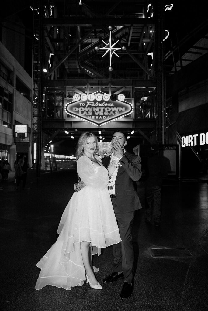 groom smokes with bride after Elvis ceremony