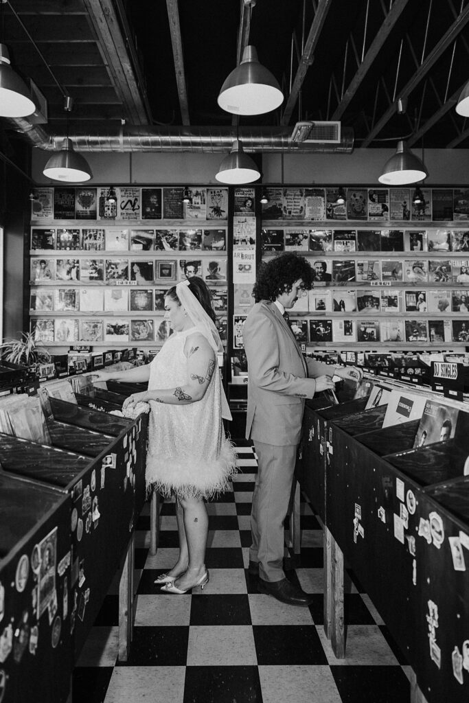 newlyweds look through records after elopement at Sure Thing Chapel