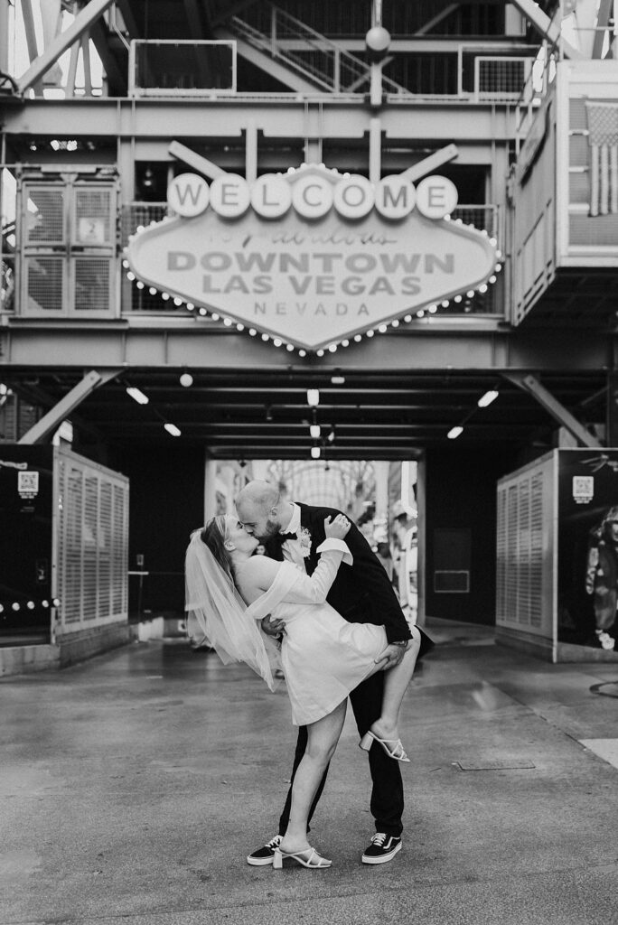 man dips woman and kisses her by Las Vegas elopement photographer