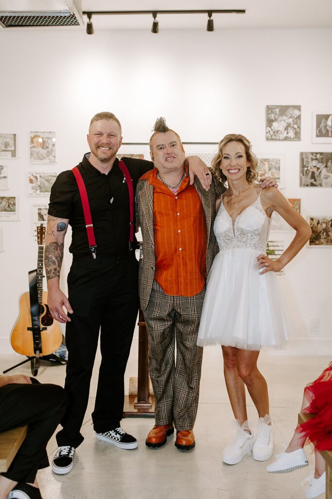 couple smiles with officiant Fat Mike by Las Vegas Wedding photographer