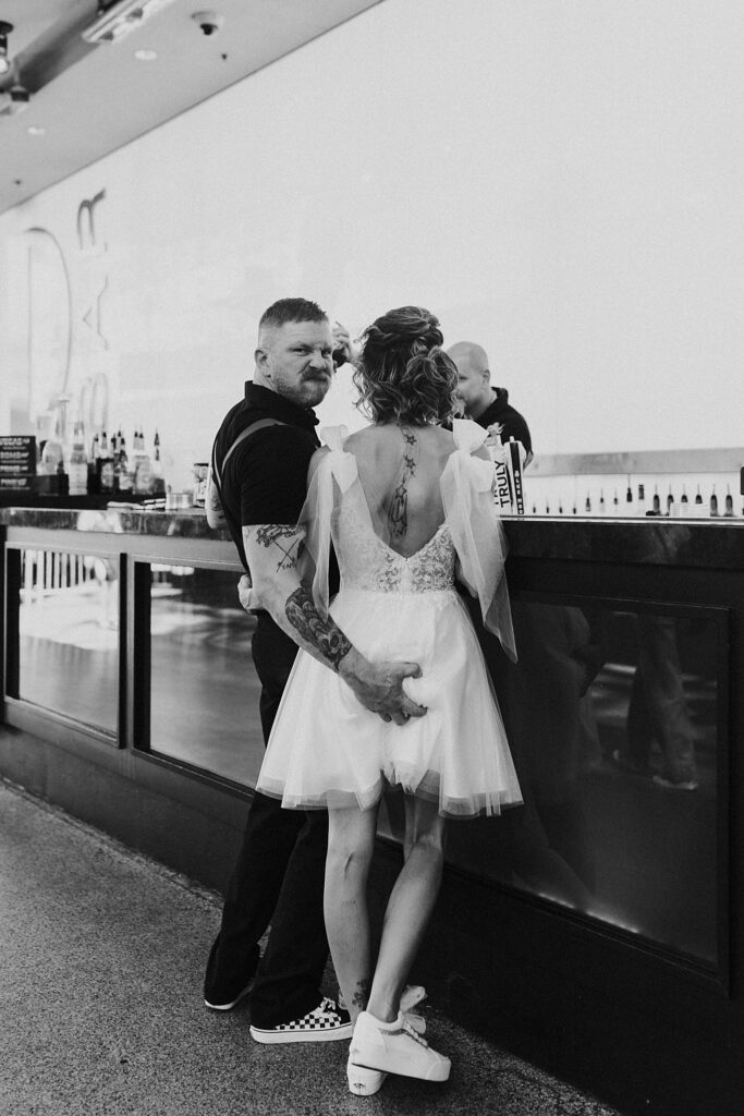 groom makes face as he grabs bride's butt by Katelyn Faye Photography 