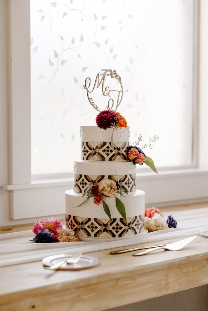 cake decorated with florals and geometric patterns by Las Vegas wedding photographer