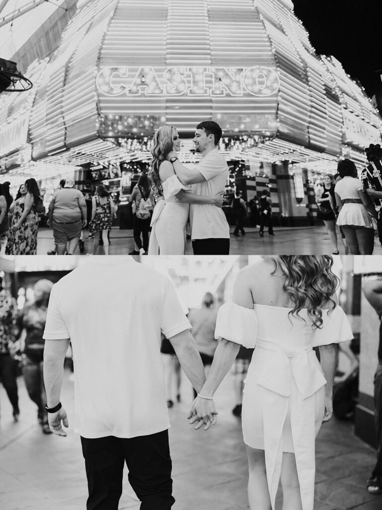 man and woman stand in front of casino sign at Fremont Street engagement session 