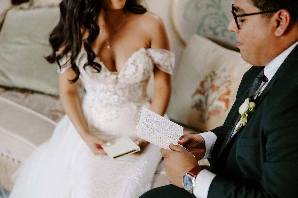 groom reads personal vows to bride before ceremony by Katelyn Faye Photography