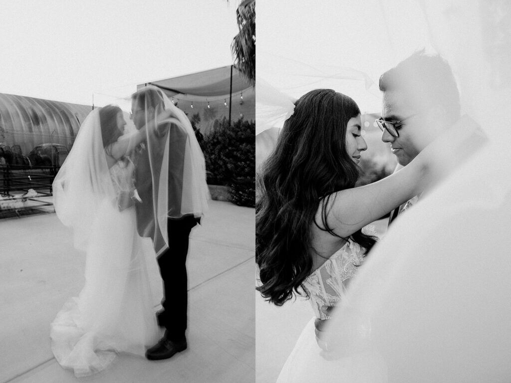 man and woman wrap arms around each other under veil by Las Vegas Wedding Photographer