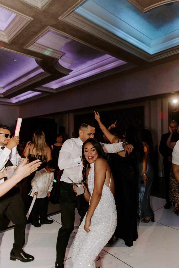 bride and groom dance during reception by Katelyn Faye Photography