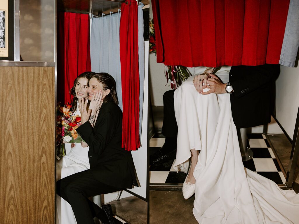 wives show off wedding rings together in photobooth by  Katelyn Faye Photography