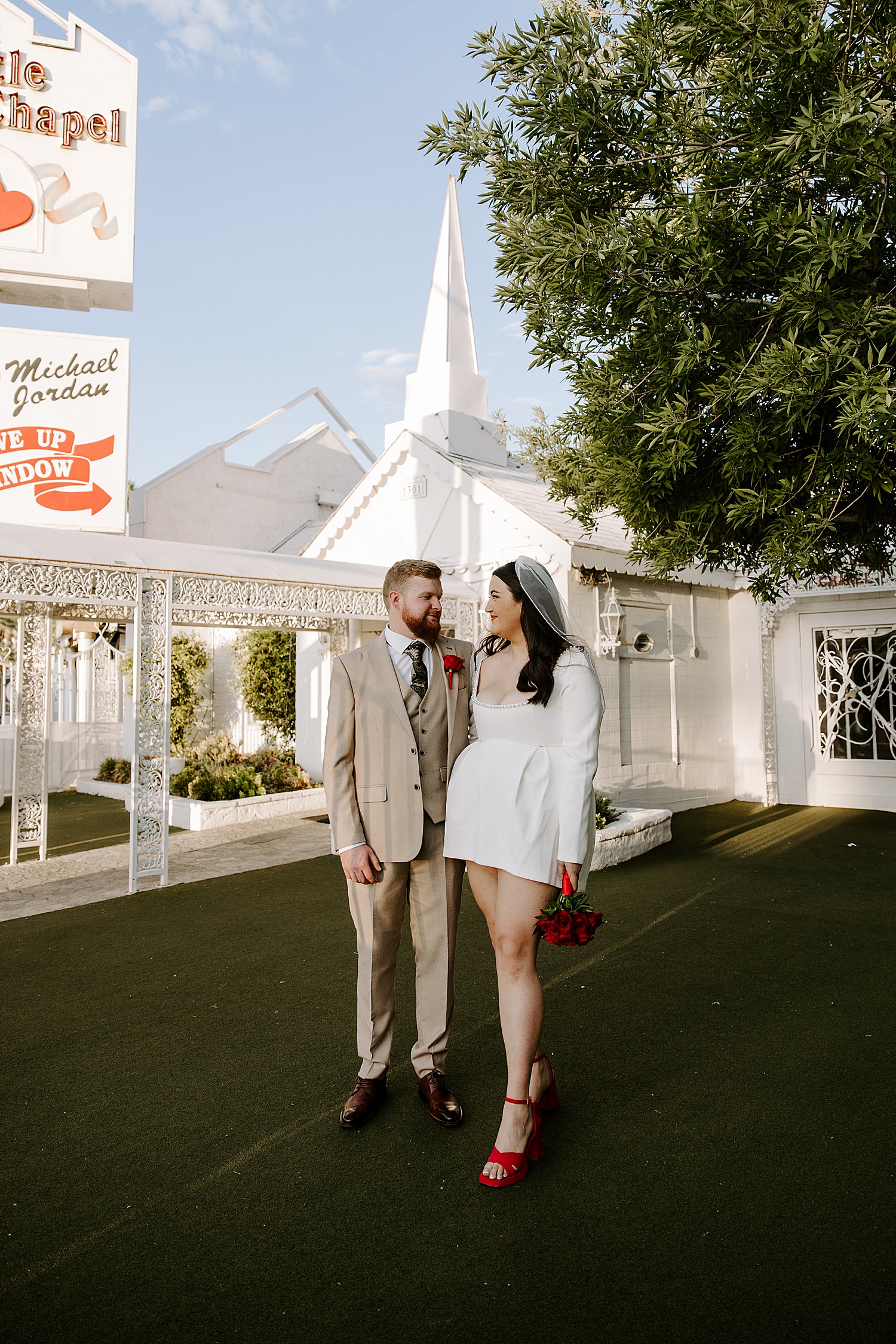 bride and groom outside the little while chapel for their wedding & engagement albums