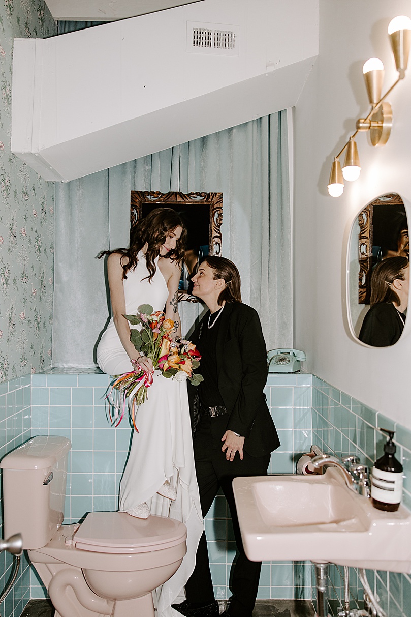 LGBTQ couple looks at each other lovingly by Katelyn Faye Photography 