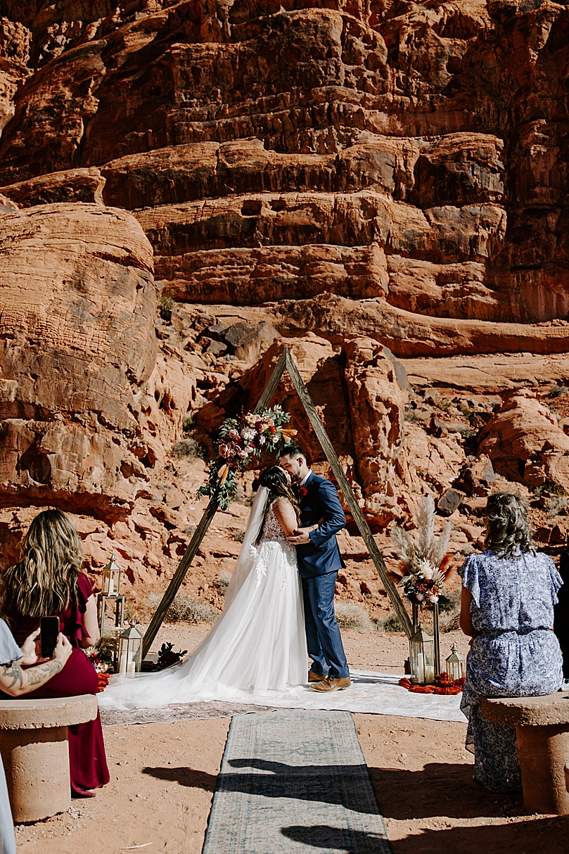 newlyweds share first kiss at Valley of Fire elopement.