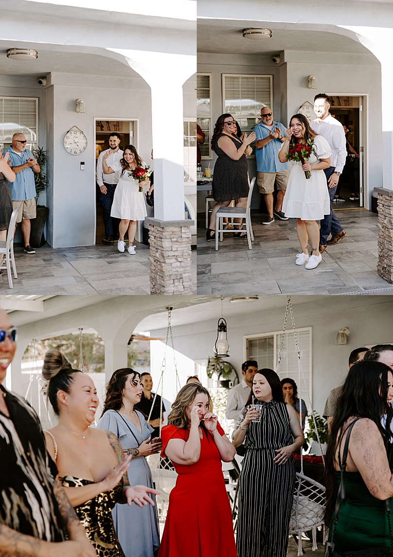 bride and groom enter backyard reception after Valley of Fire elopement