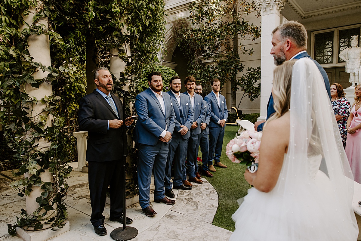 Groom meeting bride at the end of aisle by Katelyn Faye Photography