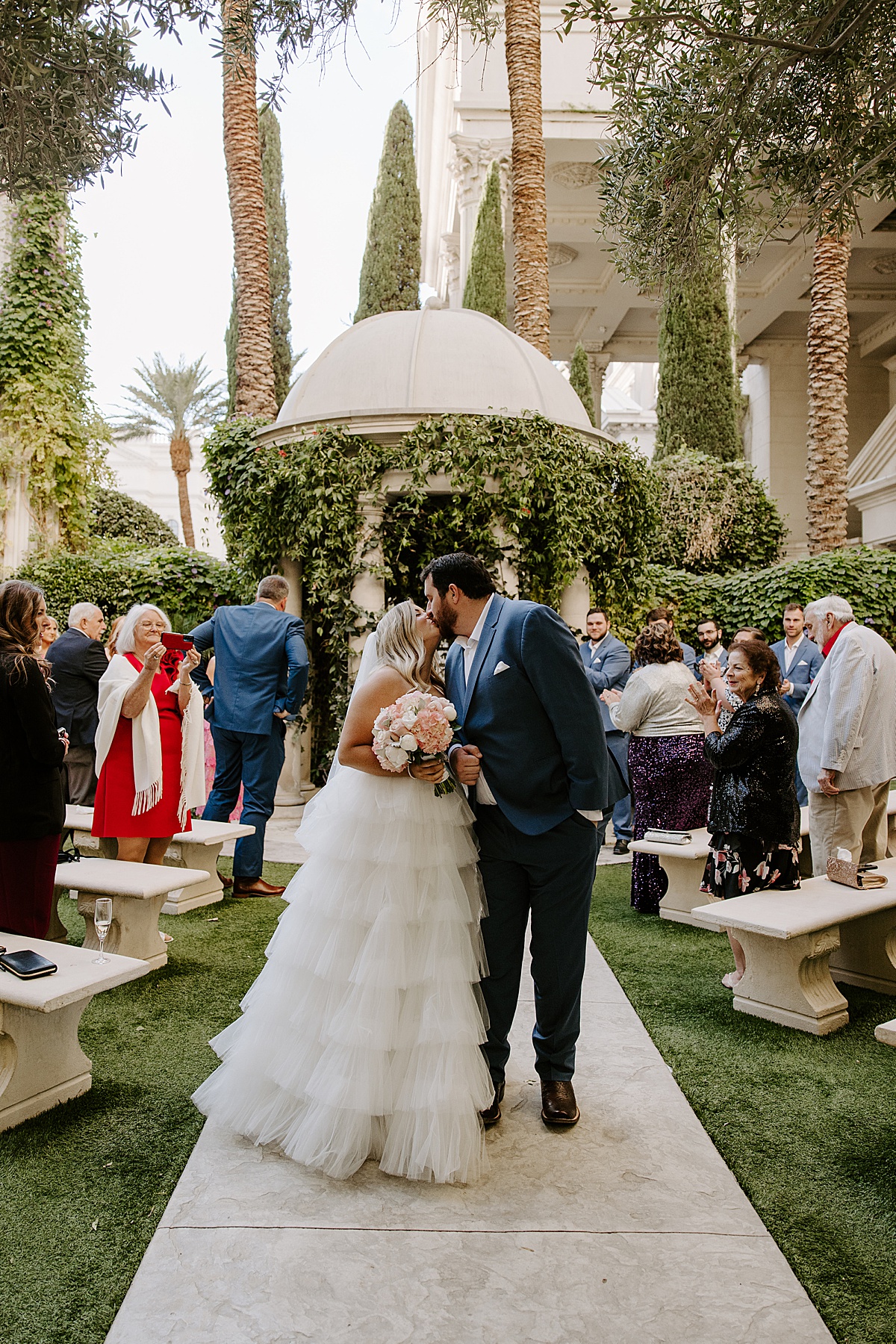 woman kisses man in tulle wedding dress by Las Vegas Wedding Photographer