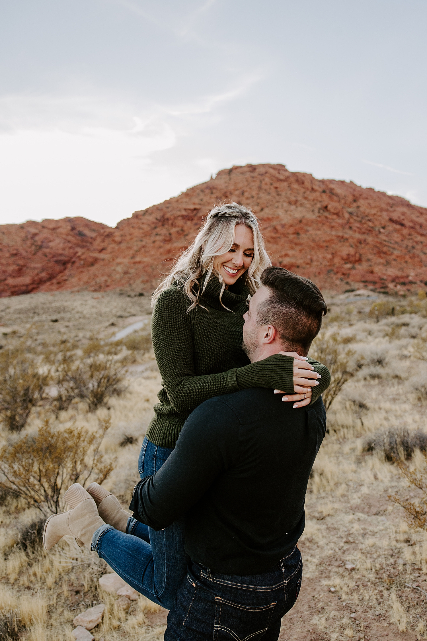 man spins fiance around in celebration by Katelyn Faye Photo