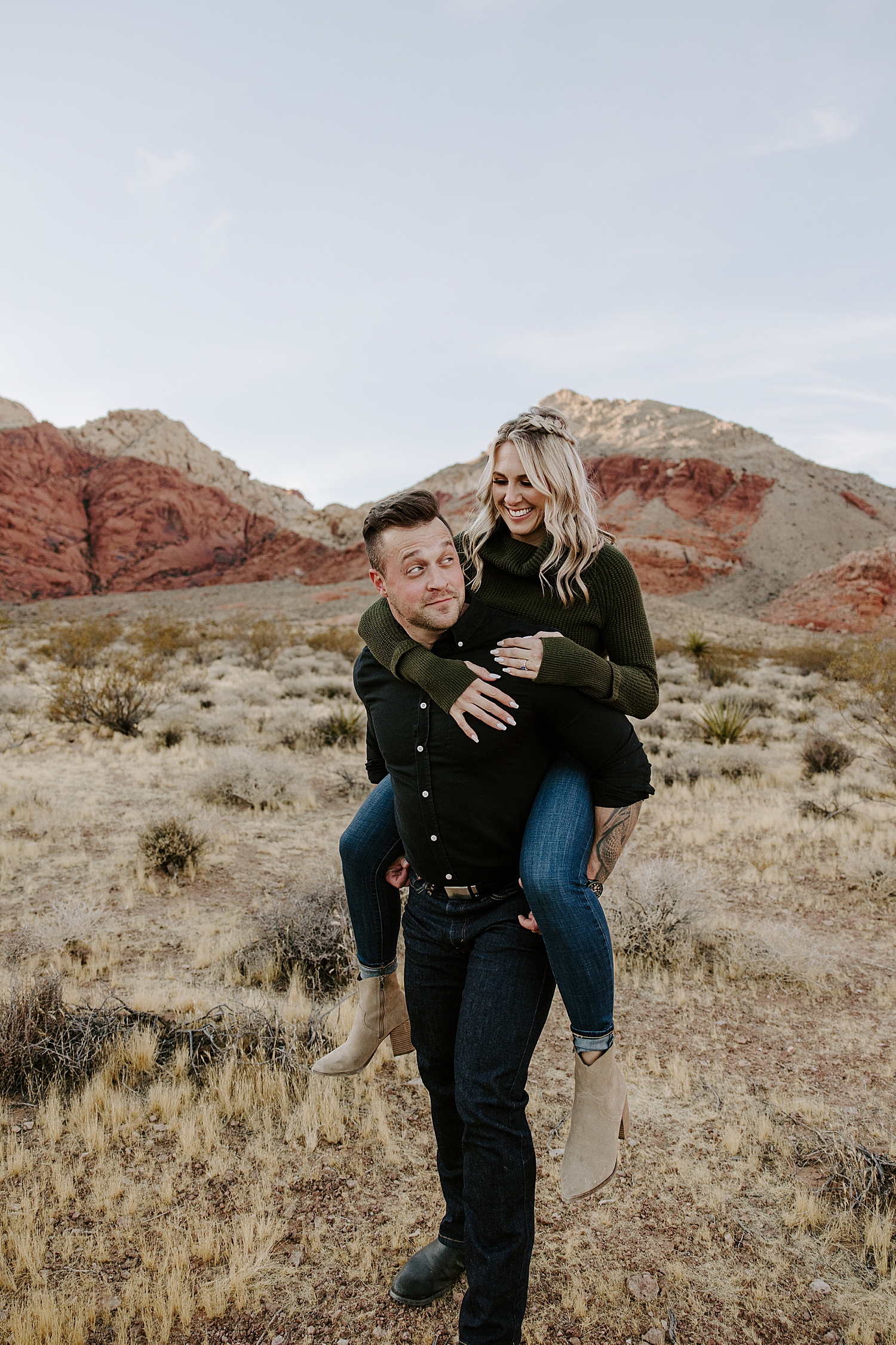 woman riding on man's back for Canyon Engagement Session