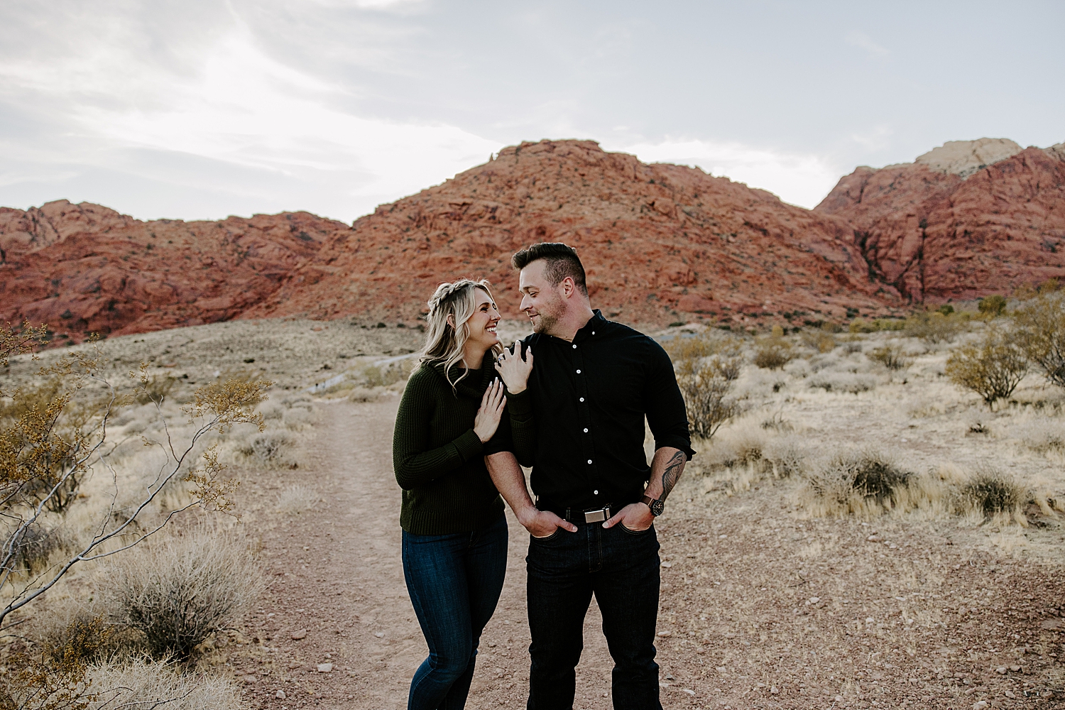 couple in all black embrace outside by Katelyn Faye Photo